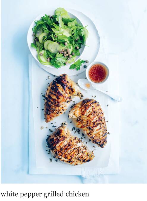 INGREDIENTS 1 tbsp white peppercorns, 2 tspn sea salt flakes, 1 tspn fennel seeds, 4 x 200g chicken breast fillets (bone in, skin on), 1 tbsp extra virgin olive oil | PARSLEY SALAD 1 tbsp red wine vinegar, 2 tspn honey, 1 tbsp vegetable oil, 3 cups flat-leaf parsley leaves (roughly chopped), 2 tbsp salted capers (rinsed), 1 Lebanese cucumber (peeled and thinly sliced) | METHOD Preheat oven to 180°C. To make the parsley salad, mix to combine the vinegar, honey and oil. Place the parsley, capers and cucumber in a bowl and toss to combine. Set both aside. Preheat a barbecue or char-grill pan over medium-low heat. Place the peppercorns, salt and fennel seeds into a mortar and grind with a pestle until the mixture is a rough powder. Score the chicken skin at regular intervals, brush with oil and sprinkle with the white pepper mixture. Cook the chicken for 5 mins each side or until golden. Transfer to a baking tray, skin-side up, and roast for 15–20 mins or until the chicken is cooked through. Serve with the parsley salad and dressing | SERVES 4
