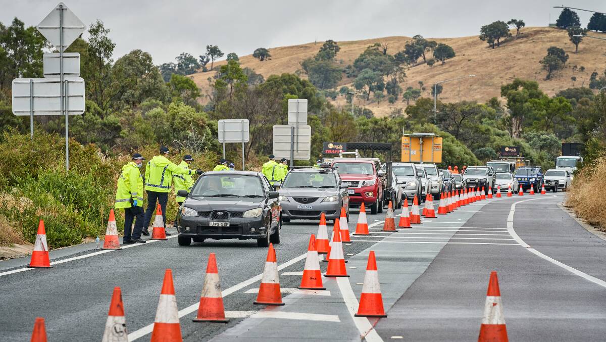 Police at an ACT border checkpoint on the Federal Highway. Picture: Matt Loxton