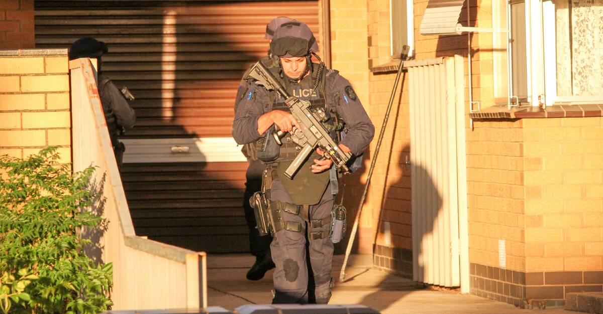 ON SCENE: Heavily armed police attended Wangaratta after shots were fired at the Belle Avenue home on Anzac Day last year. Ora Holt and Greg Floyd died. 