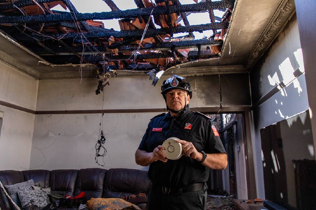 STAY SAFE: Fire and Rescue NSW Commissioner Paul Baxter is urging people to have a working carbon monoxide smoke alarm in their home. He is pictured in the aftermath of a house fire in a Sydney home. Picture: FRNSW